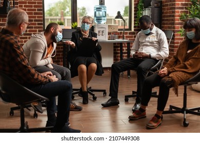 People With Addiction Meeting At Aa Group Therapy Session To Receive Counseling From Therapist. Patients With Face Masks Attending Aa Support Program During Covid 19 Pandemic.