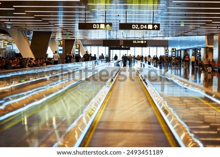People, airport and mobile walkway or terminal in lobby as waiting area for passenger and traveller in Dubai. Crowd, luggage and boarding on immigration for international or global travel for trip