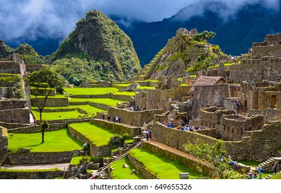 People In Ancient Inca City Of Machu Picchu, Peru Panorama