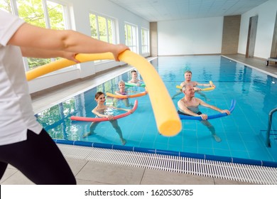 People In Aqua Fitness Class During A Physical Therapy Session In A Physiotherapy Center