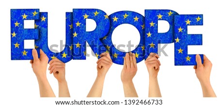 people arms hands holding up wooden letter lettring forming word Europe in european union national flag colors tourism travel elections concept isolated on white background
