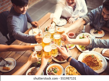 People in asian are celebrating the festival they clink glasses beer and dinner happy.top view