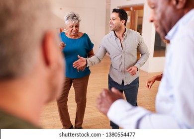 People Attending Dance Class In Community Center