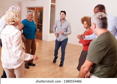 People Attending Dance Class In Community Center