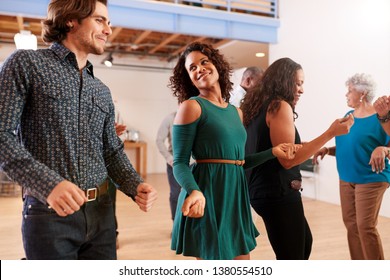 People Attending Dance Class In Community Center