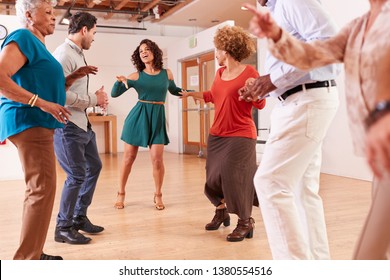 People Attending Dance Class In Community Center