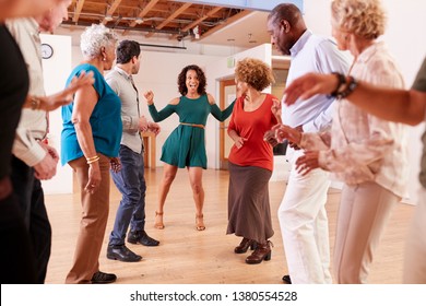 People Attending Dance Class In Community Center