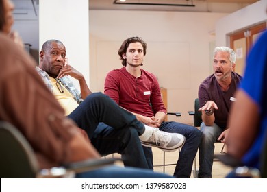 People Attending Self Help Therapy Group Meeting In Community Center