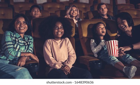 People Audience Watching Movie In The Movie Theater Cinema. Group Recreation Activity And Entertainment Concept.