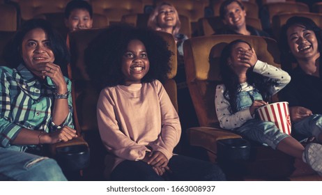 People Audience Watching Movie In The Movie Theater Cinema. Group Recreation Activity And Entertainment Concept.