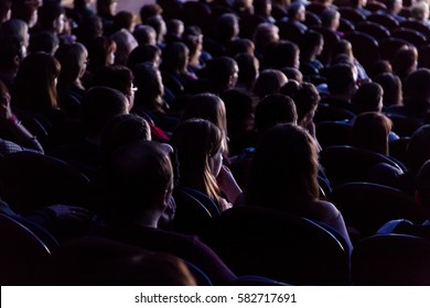 People In The Auditorium Looking At The Stage. Shooting From The Back