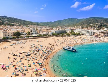 People At Beach In Spain