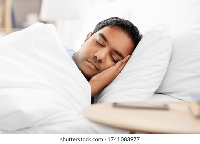 People, Bedtime And Rest Concept - Indian Man Sleeping In Bed At Home