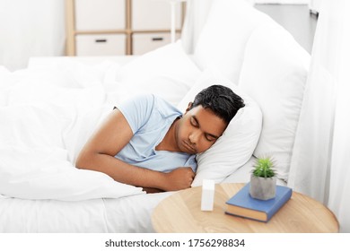 People, Bedtime And Rest Concept - Indian Man Sleeping In Bed At Home