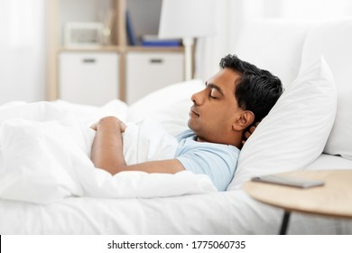 People, Bedtime And Rest Concept - Indian Man Sleeping In Bed At Home