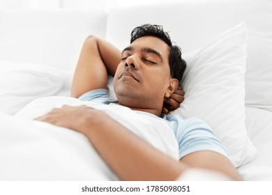 People, Bedtime And Rest Concept - Indian Man Sleeping In Bed At Home