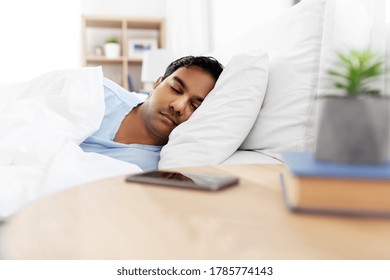 People, Bedtime And Rest Concept - Indian Man Sleeping In Bed At Home