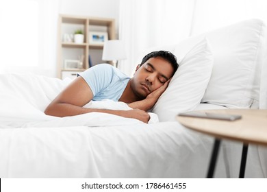 People, Bedtime And Rest Concept - Indian Man Sleeping In Bed At Home