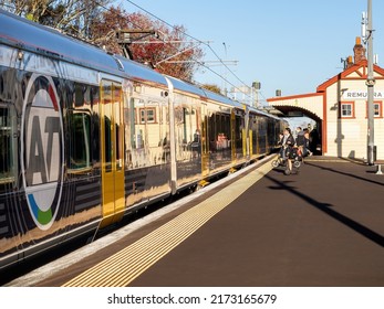 People Boarding Auckland Transport Electric Train At Remuera Station. Auckland, New Zealand - June 1, 2021