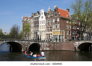 People Boating In An Amsterdam Canal