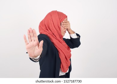 People, Body Language. Young European Muslim Woman Covers Eyes With Palm And Doing Stop Gesture, Tries To Hide From Everybody. Don't Look At Me, I Don't Want To See, Feels Ashamed Or Scared.