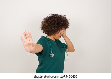 People, Body Language. Young European Doctor Woman Covers Eyes With Palm And Doing Stop Gesture, Tries To Hide From Everybody. Don't Look At Me, I Don't Want To See, Feels Ashamed Or Scared.
