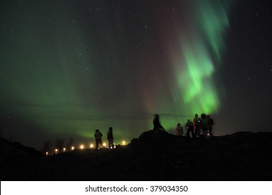 People Braving The Cold To Watch The Northern Lights. Tromso, Norway.