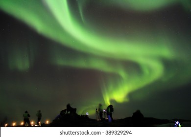 People Braving The Cold To Watch And Photograph The Northern Lights. Tromso, Norway.