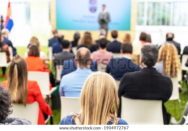 People at business conference, corporate\
presentation or political\
meeting