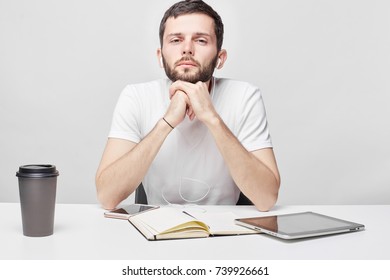 People, Business, Occupation Concept. Sad And Tired Caucasian Male Manager Can't Focus On His Duties, Thinking About Problems In His Relationships, As Sits At Work Place, Feeling Lonely And Upset.