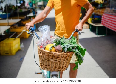 People buying fruits and vegetables. Summer outdoors farm market shopping background. Real purchasing selling natural healthy lifestyle candid closeup image.