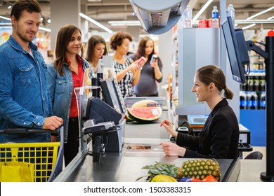 People buying goods in a grocery store - Shutterstock ID 1503383315