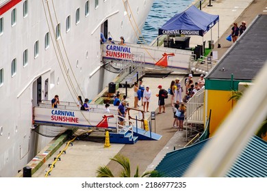 People By The Gangway Getting On Board Of Carnival Cruise Ship Docked In Port Of Nassau,  Bahamas. June 20, 2022. Carnival Sunshine