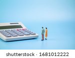 People and calculators in solid background