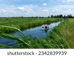 People in a canoe in Alde Feanen National Park - Friesland, The Netherlands