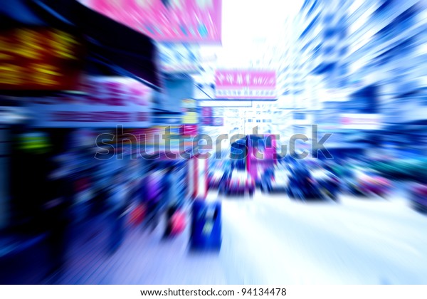 people and\
car rushing on the street in motion\
blur