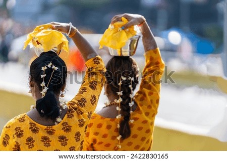 People carrying milk pot offering in Thaipusam 