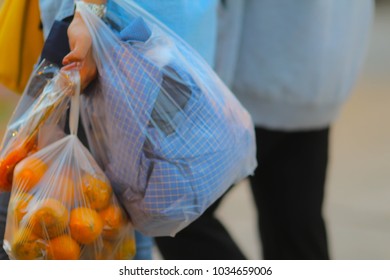 People Are Carrying Plastic Bags In The Market With Soft Focus And Blurry