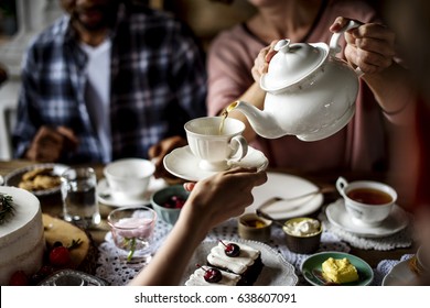 People Celebrate Birthday Party With Cake And Tea