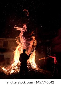 People Celebrate St John's Eve Around A Bonfire In A Greek Village