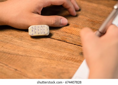 People cheating on test by writing answer on eraser