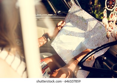 People Checking The Map for Direction on Road Trip