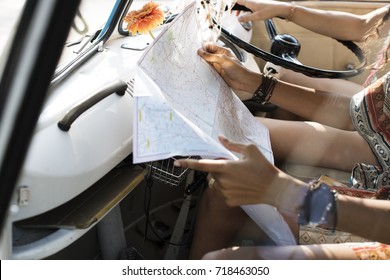 People Checking The Map For Direction On Road Trip