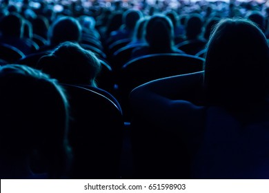 People, children, adults, parents in the theater watching the performance. People in the auditorium looking at the stage. Shooting from the back - Shutterstock ID 651598903