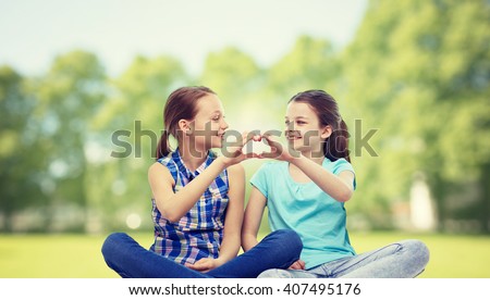 Similar – Image, Stock Photo smiling girls best friends lying on beach while looking camera