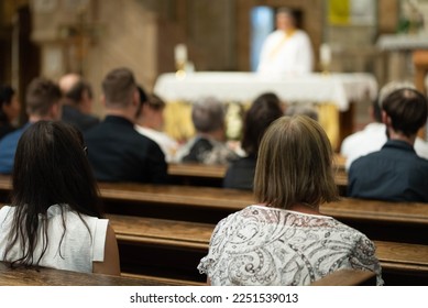 People in a church listening to the mass