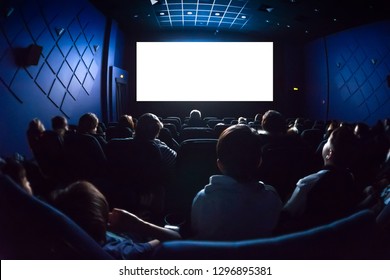 People In The Cinema Watching A Movie. Blank Empty White Screen