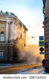 People Clean Snow From The Roof Of A House In The City Center In The Morning. The Municipal Service Throws Snow Off The Roof. Saint Petersburg, Russia - 5 Dec 2021