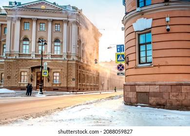 People Clean Snow From The Roof Of A House In The City Center In The Morning. The Municipal Service Throws Snow Off The Roof. Saint Petersburg, Russia - 5 Dec 2021