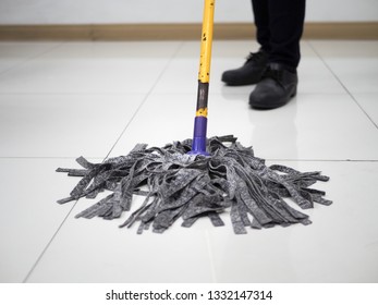 People Cleaning And Mop The Floor  With Mop